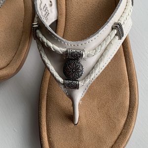 Minnetonka white sandals size 8. Only worn twice.